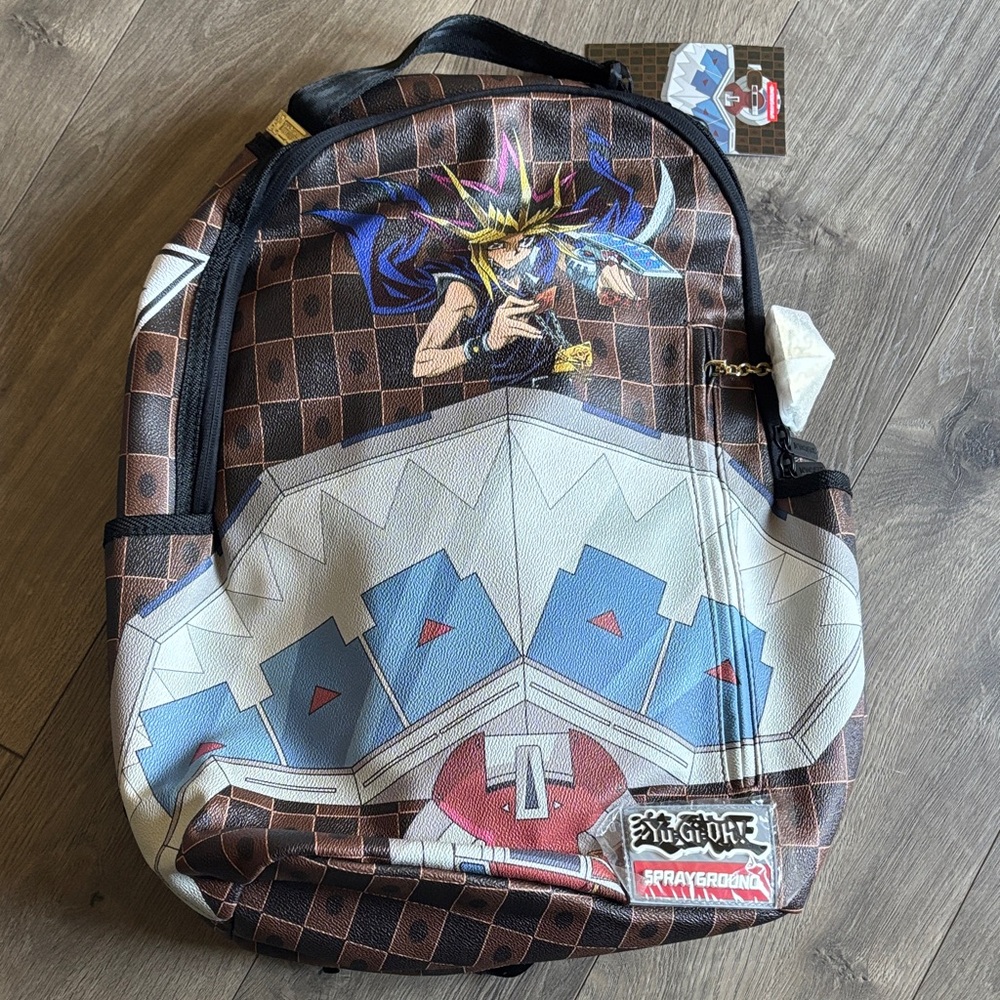Sprayground Yu-Gi-Oh! Brown, White, and Blue Backpack